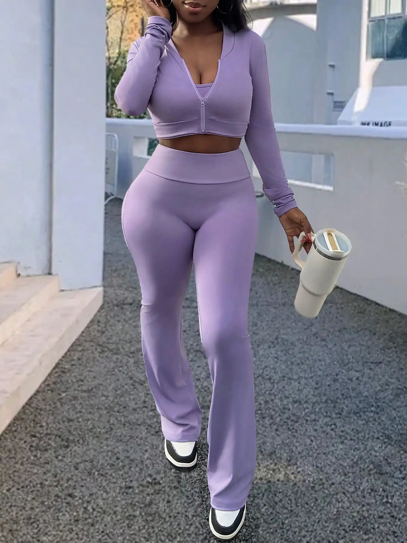 A Fashionable and Comfortable 3-piece Summer Casual Sportswear Set Featuring A Purple Sports Top and Flared Pants for Women