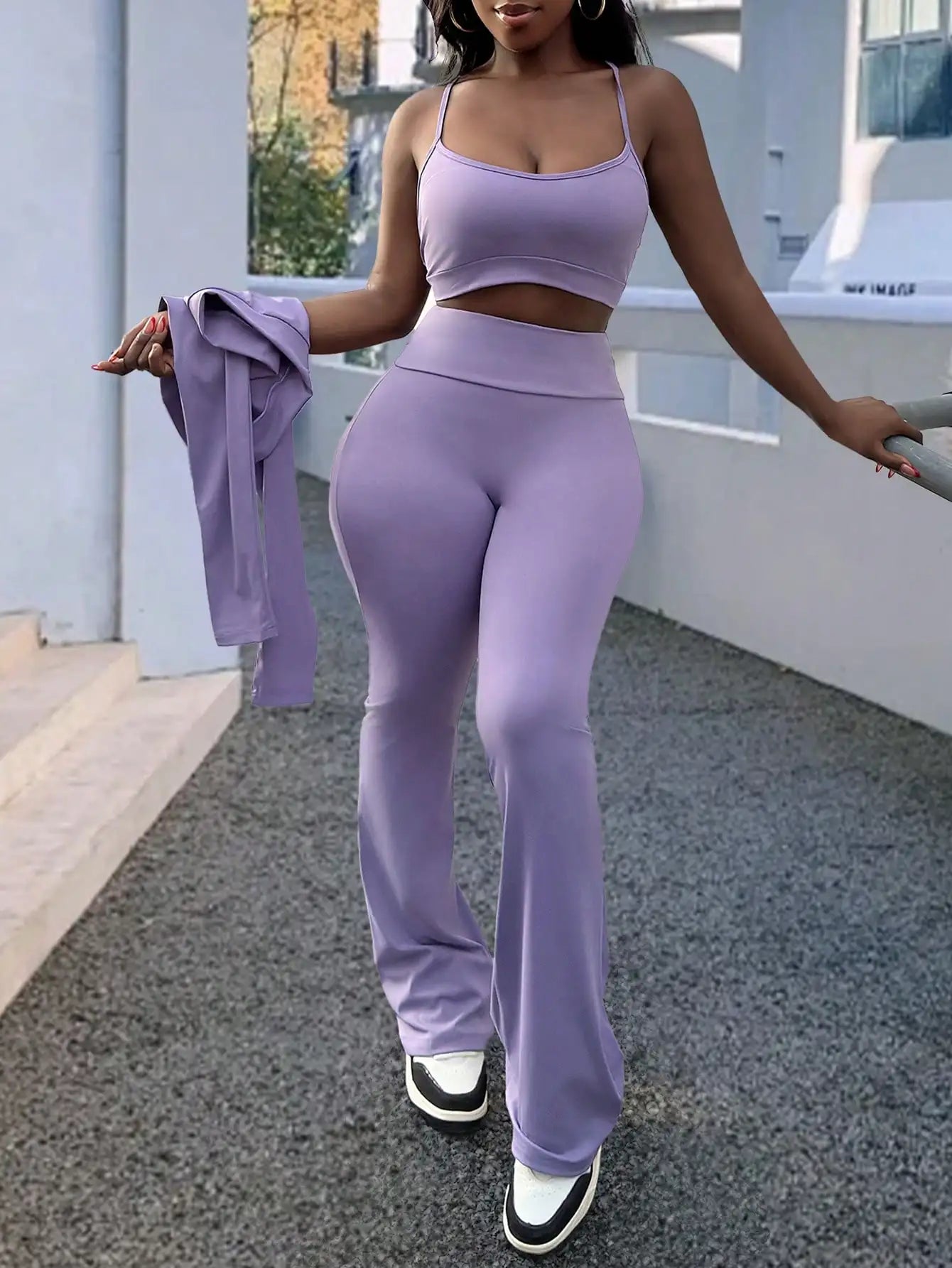 A Fashionable and Comfortable 3-piece Summer Casual Sportswear Set Featuring A Purple Sports Top and Flared Pants for Women