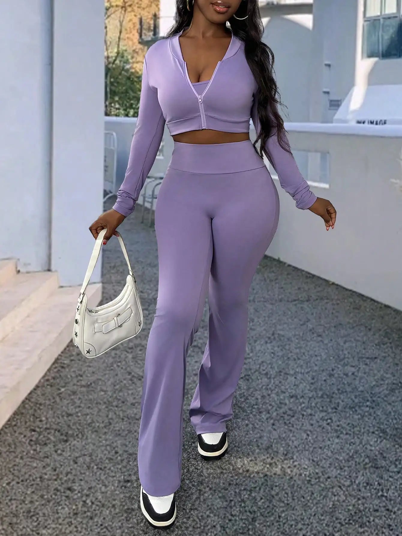 A Fashionable and Comfortable 3-piece Summer Casual Sportswear Set Featuring A Purple Sports Top and Flared Pants for Women
