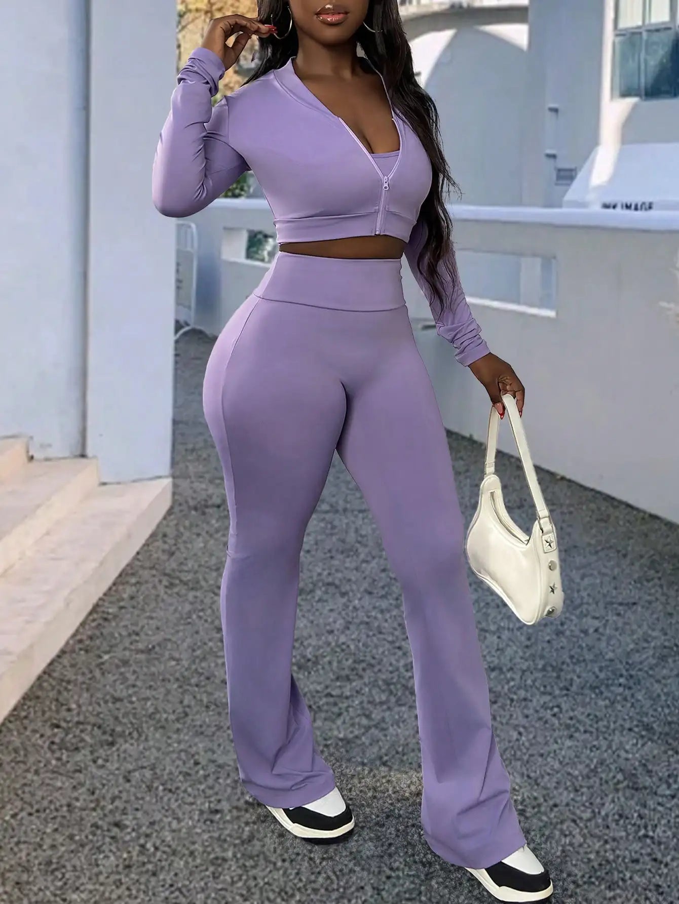 A Fashionable and Comfortable 3-piece Summer Casual Sportswear Set Featuring A Purple Sports Top and Flared Pants for Women
